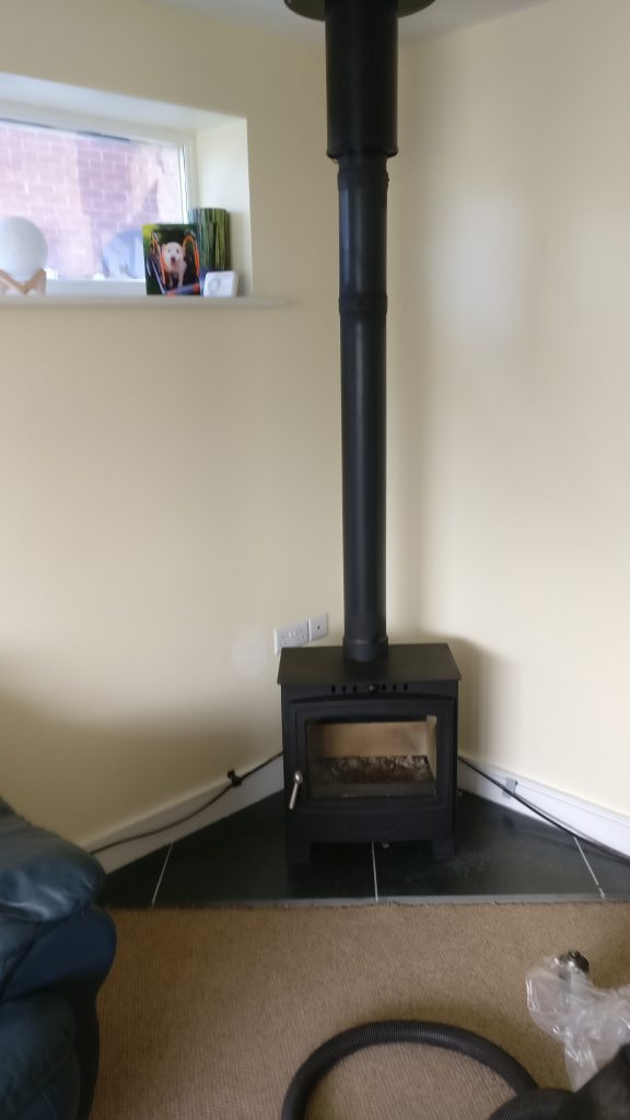 tall wood burner with pipe